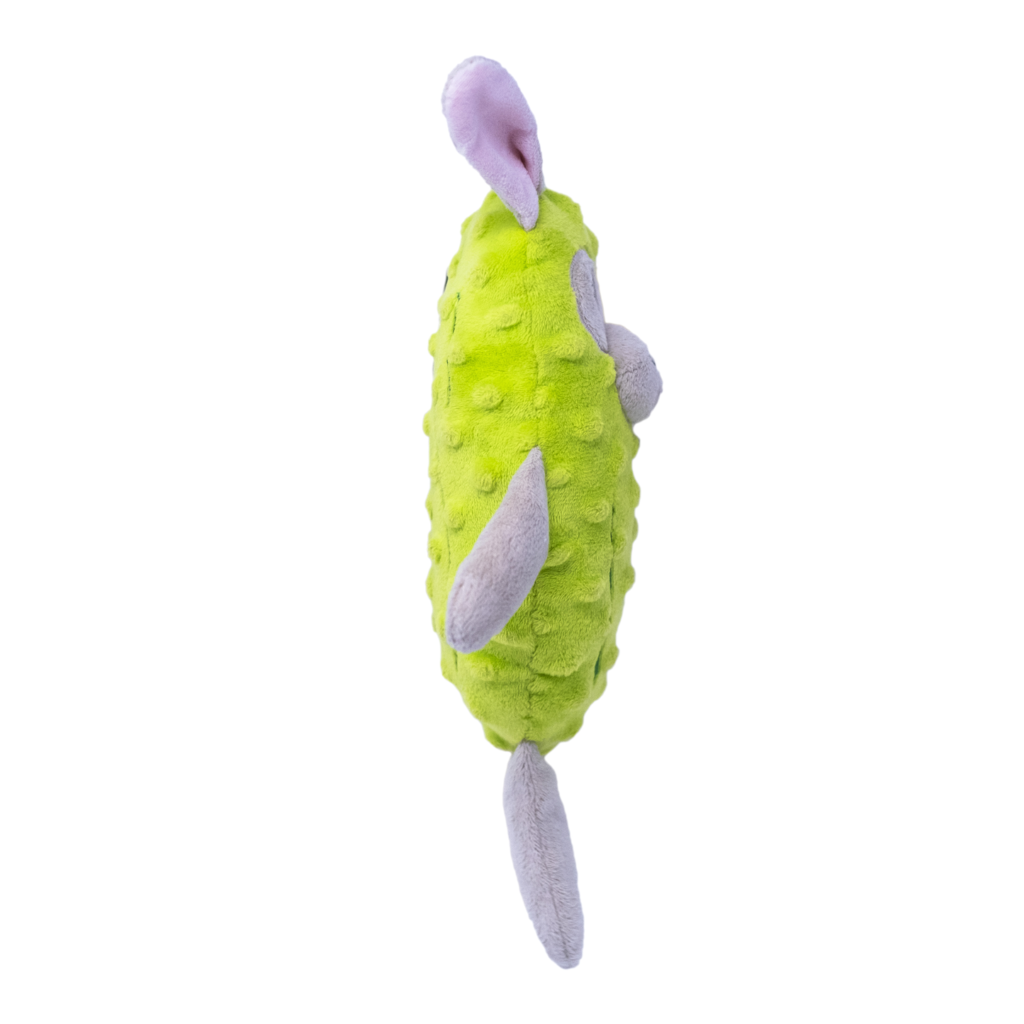 The side view of a plush green dog toy resembling a bunny in a pickle costume on a white background