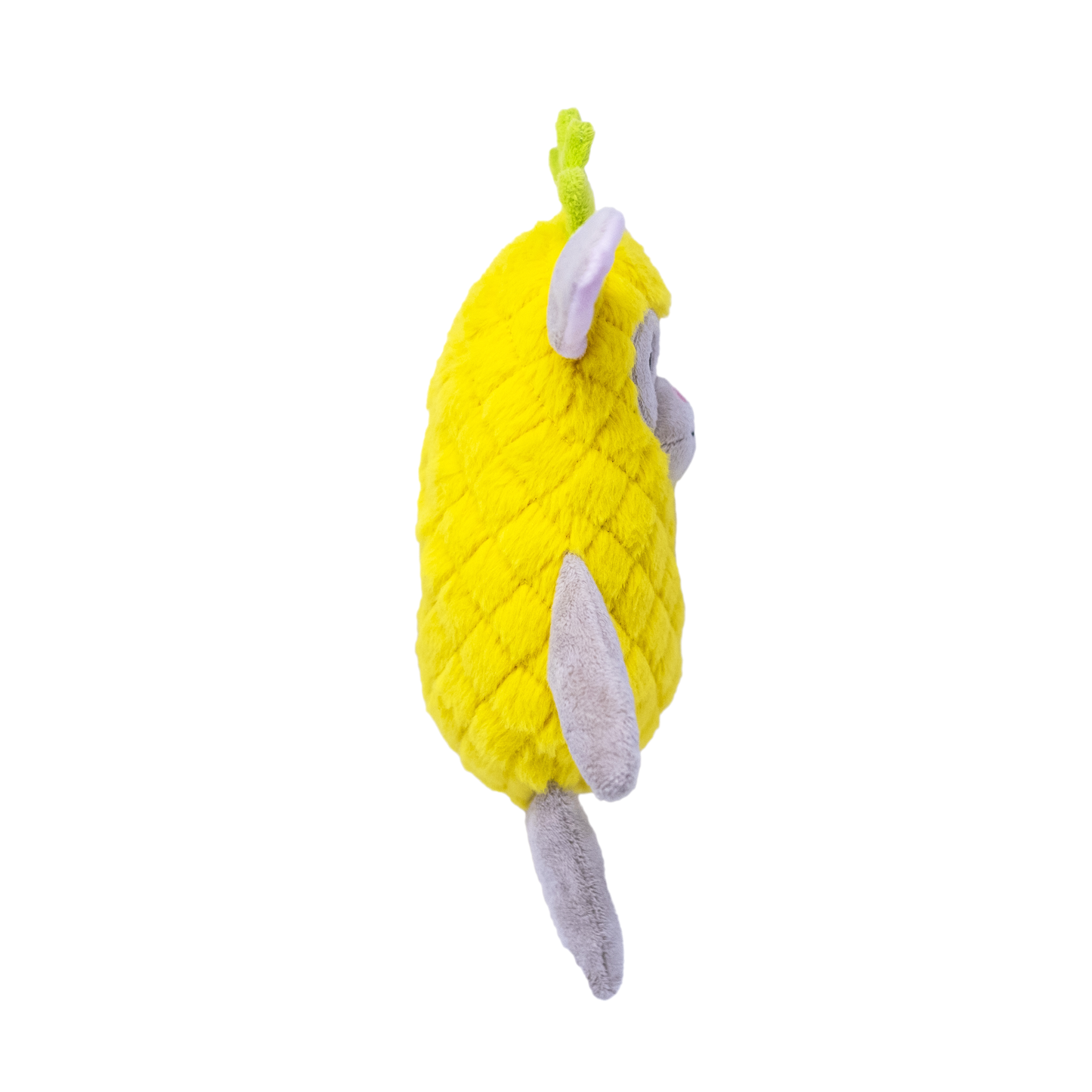 The side view of a plush yellow dog toy resembling a bunny in a pineapple costume on a white background
