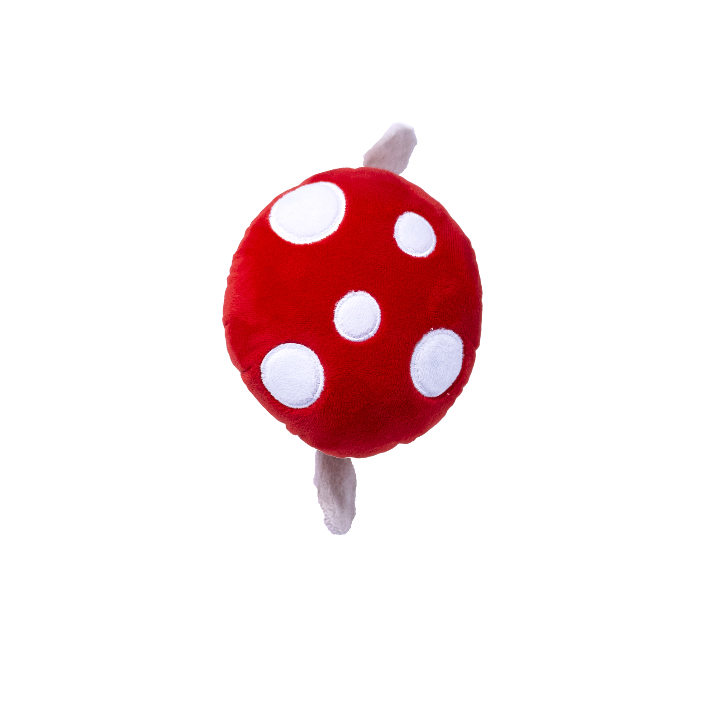 The top view of a plush red and white dog toy resembling a bunny in a mushroom costume on a white background
