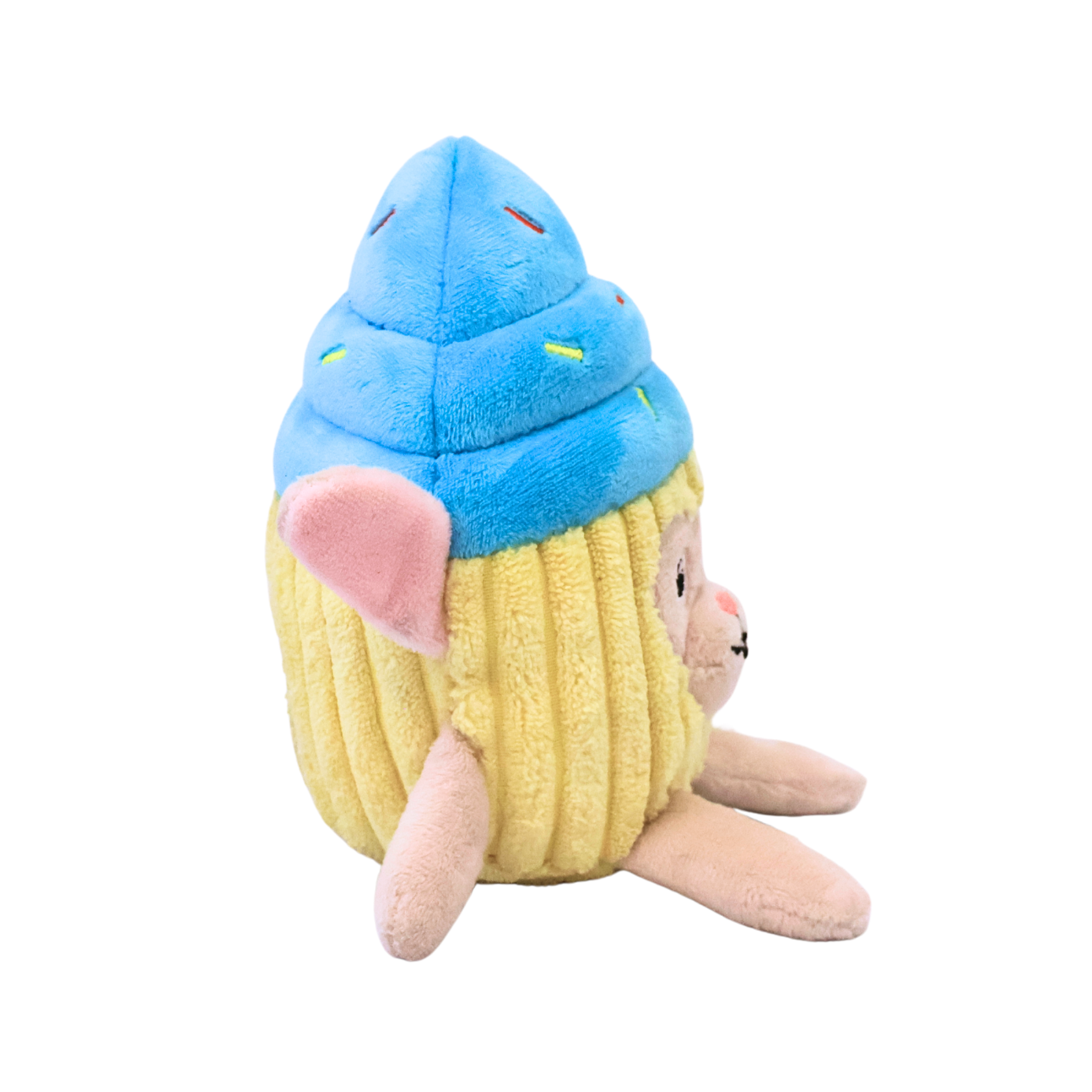 The side view of a plush dog toy resembling a bunny in a blue frosted cupcake costume on a white background