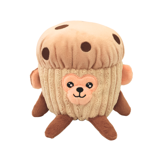 A plush brown dog toy resembling a monkey in a chocolate chip muffin costume on a white background
